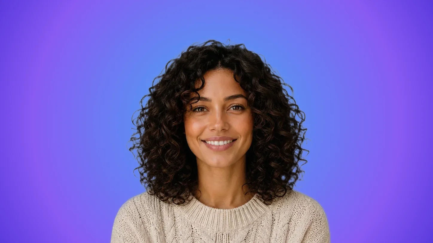 Professional headshot on a saturated brand color background
