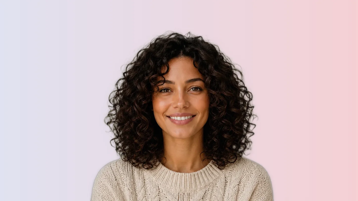 Professional headshot on a soft cool gradient background