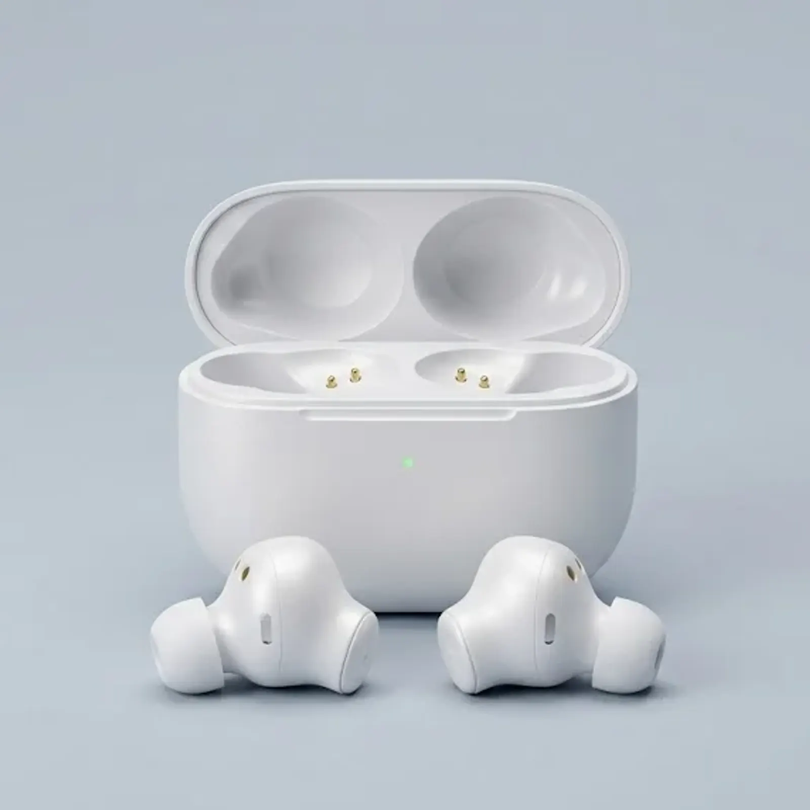 Phone photo of white wireless earbuds on a kitchen counter