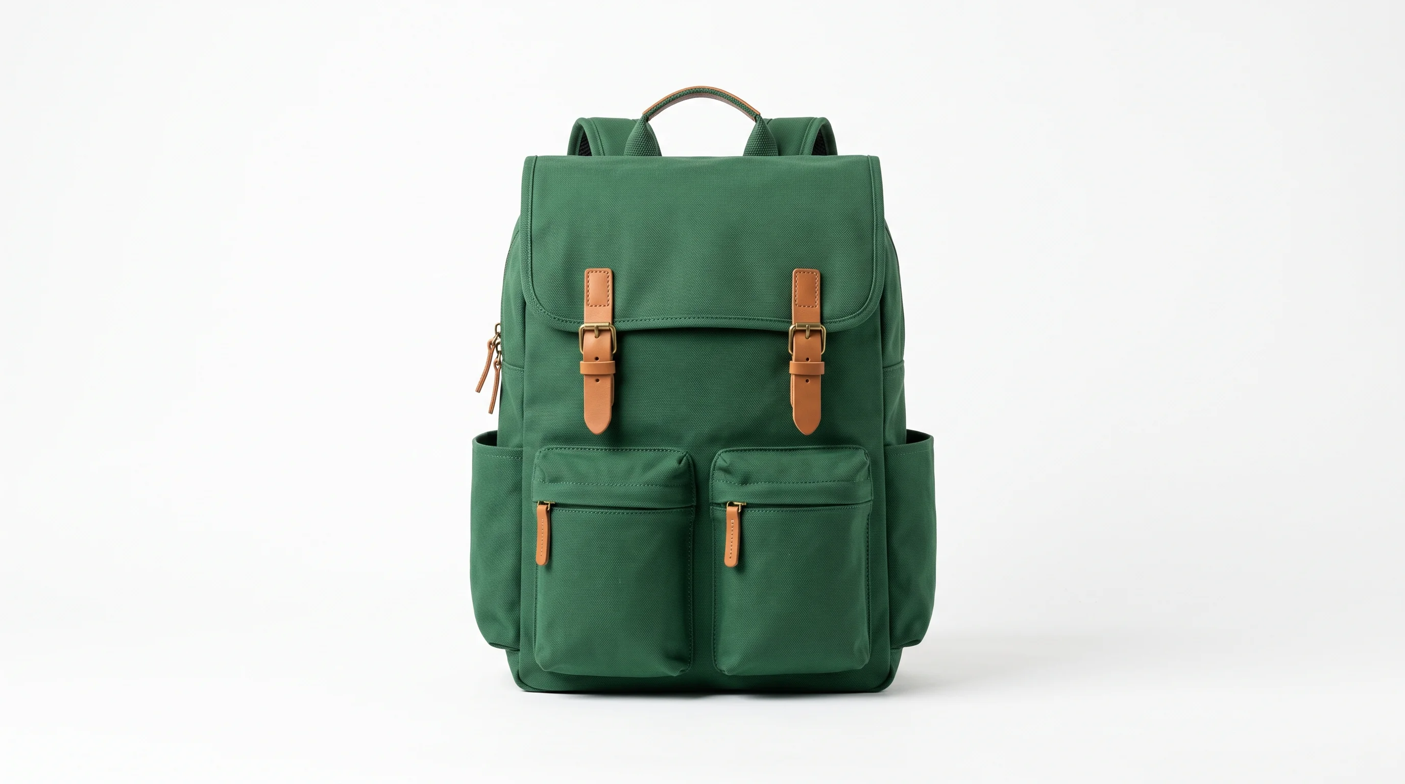A forest green canvas backpack photographed upright on a plain white studio background