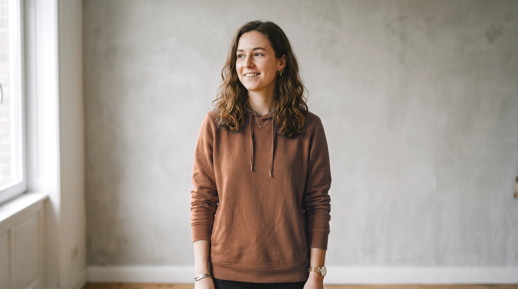 The same hoodie recolored to rust with folds intact